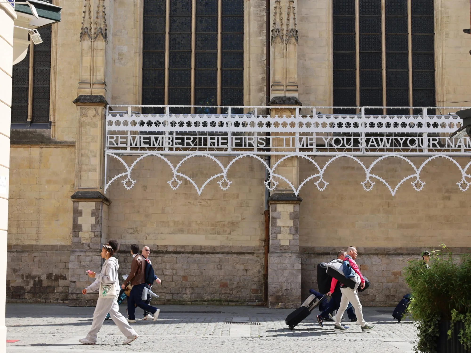 “Fiesta” by Marinella Senatore installed between the buttresses of Saint-Maurice church, Lille, lille3000 2025.